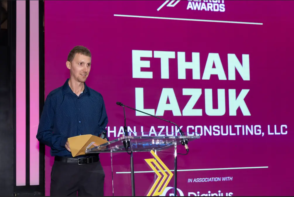 Ethan Lazuk at the US Search Awards 2026 presenting an award on stage.